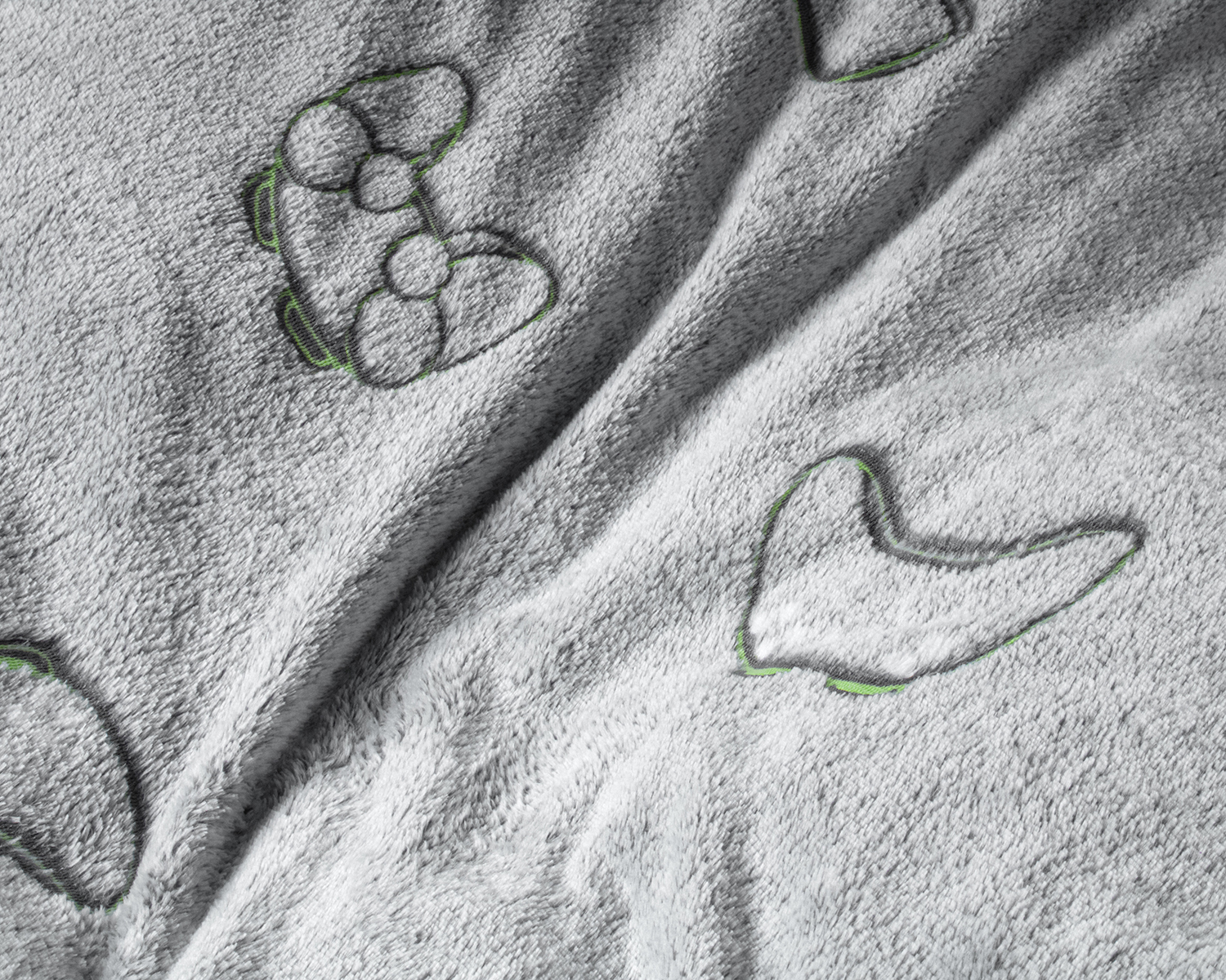 Detail dekbedovertrek met spelcomputer controllers